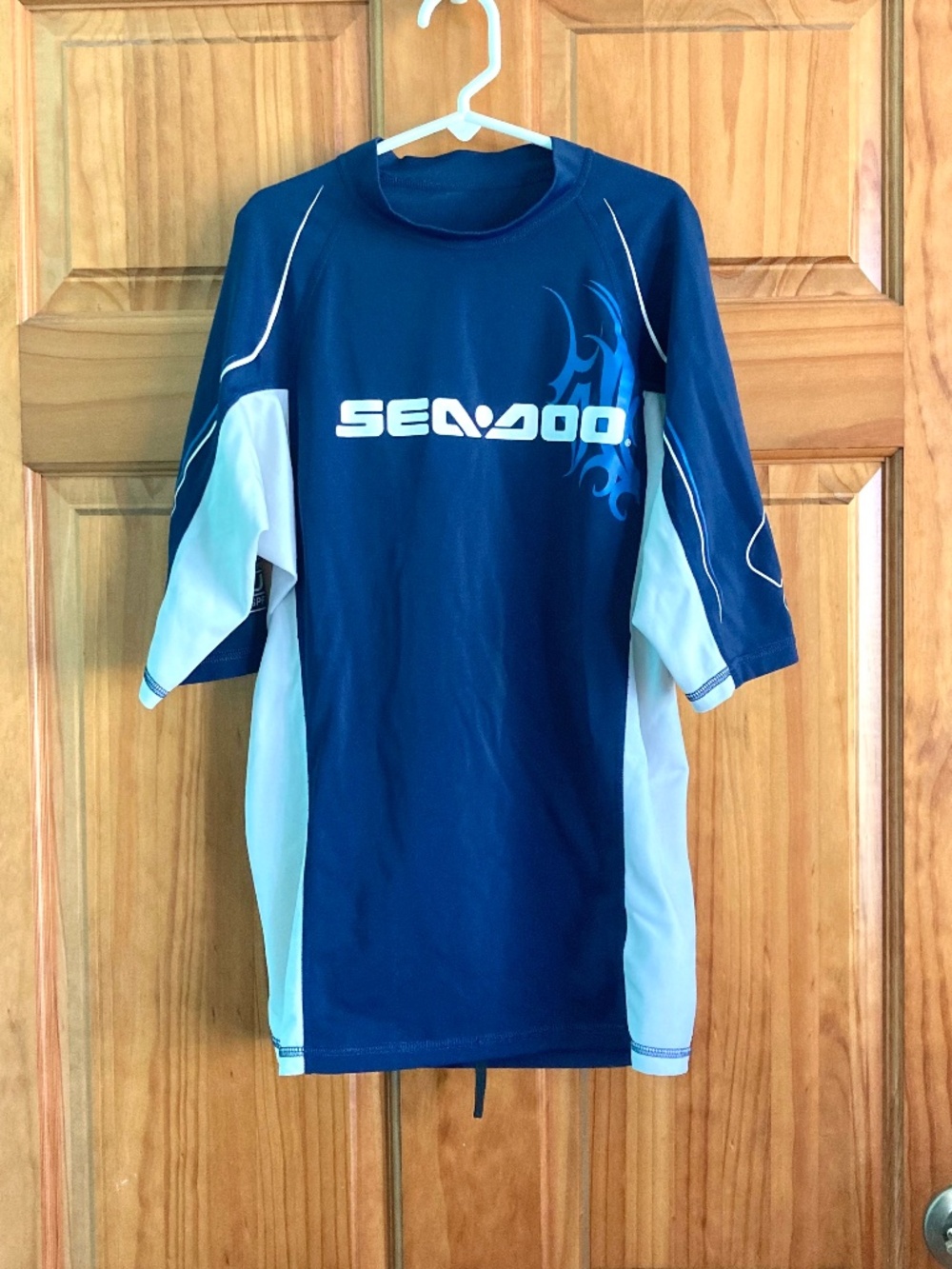 Boy’s size 12/14 Sea-Doo navy blue and white short sleeved swim shirt/rash guard